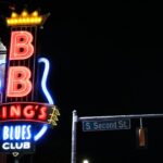 a neon sign on the side of a building